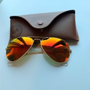 Ray-Ban Gold Frame Sunglasses with Red-Orange Lenses
